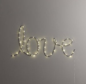 A simple strand of lights spelling a word like "love" would be simple and beautiful. 